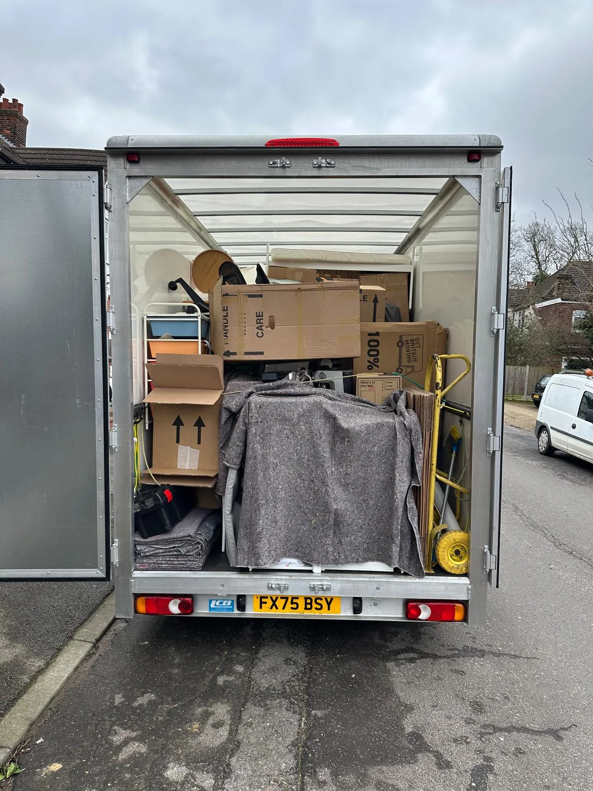 Removals team loading a Luton van